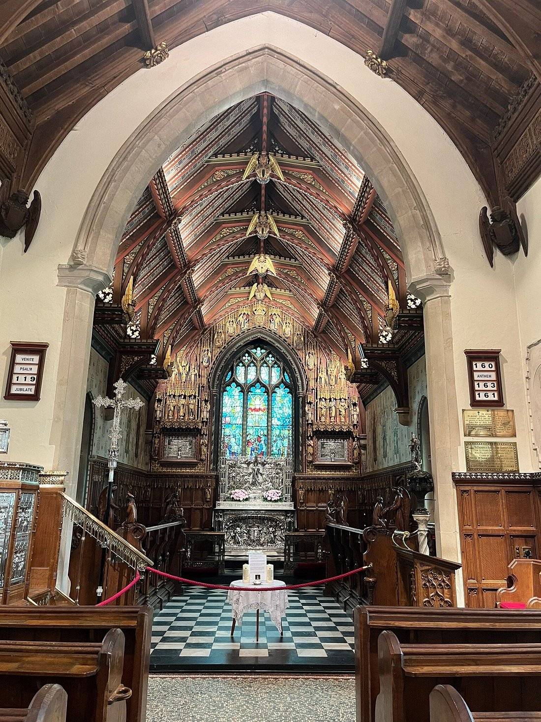 The richly decorated interior of St Mary Magdalene church at Sandringham, with a gilded roof, silver altar and stained glass